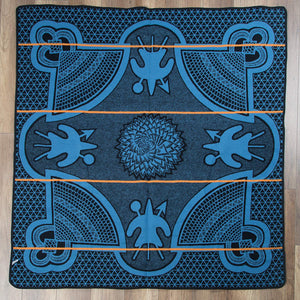 Peacock Kharetsa Spiral Aloe Basotho Heritage Blanket by Aranda Textiles. Handmade in South Africa. The Basotho heritage blankets are made using a vertical manufacturing process. The 50% wool and 50% Draylon blended yarn is spun in-house, then woven using state-of-the-art jacquard weave technology into the finest quality Basotho blankets. Color blue.