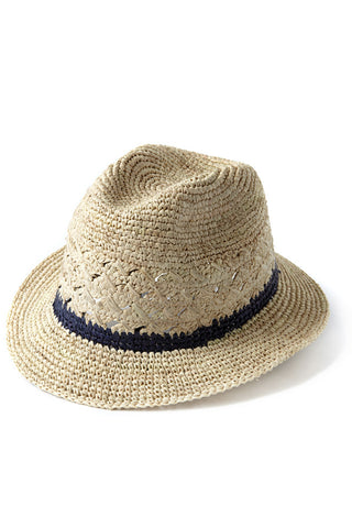 Avery Natural Crocheted Fedora by Mar y Sol Spring 2018. This classic short brimmed fedora features a band of contrasting color and crocheted venting. Materials: 100% raffiaDimensions: 2" brim, 5" crown, 22" circumference Handmade in Madagascar