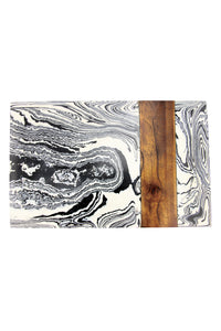 Zebra Marble Board by Be Home. Handcrafted in India. Designed in Northern California, the Zebra Marble Board is handcrafted by master artisans in India from white marble, resin composites, and mango wood accents. 100% food safe. Color blue and white.