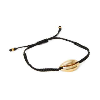 Gold cowrie shell on a black woven bracelet