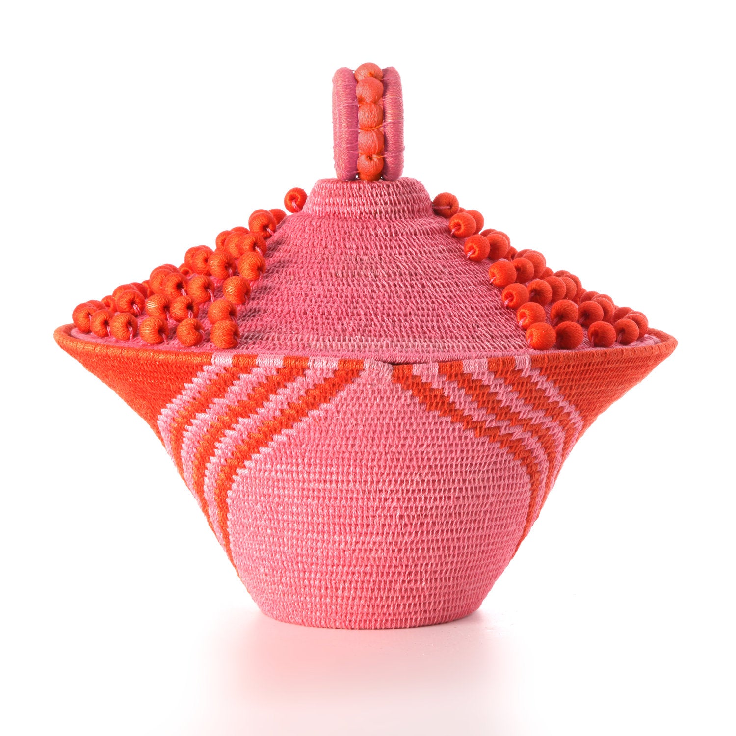 Peony Lidded Basket Urn by Charlie Sprout. Handmade in Swaziland, these unique and bold decorative accents support female artisans and are bold additions to any room. Swazi baskets are the most labor intensive of all the African baskets, taking between 30-80 hours to make each piece. 