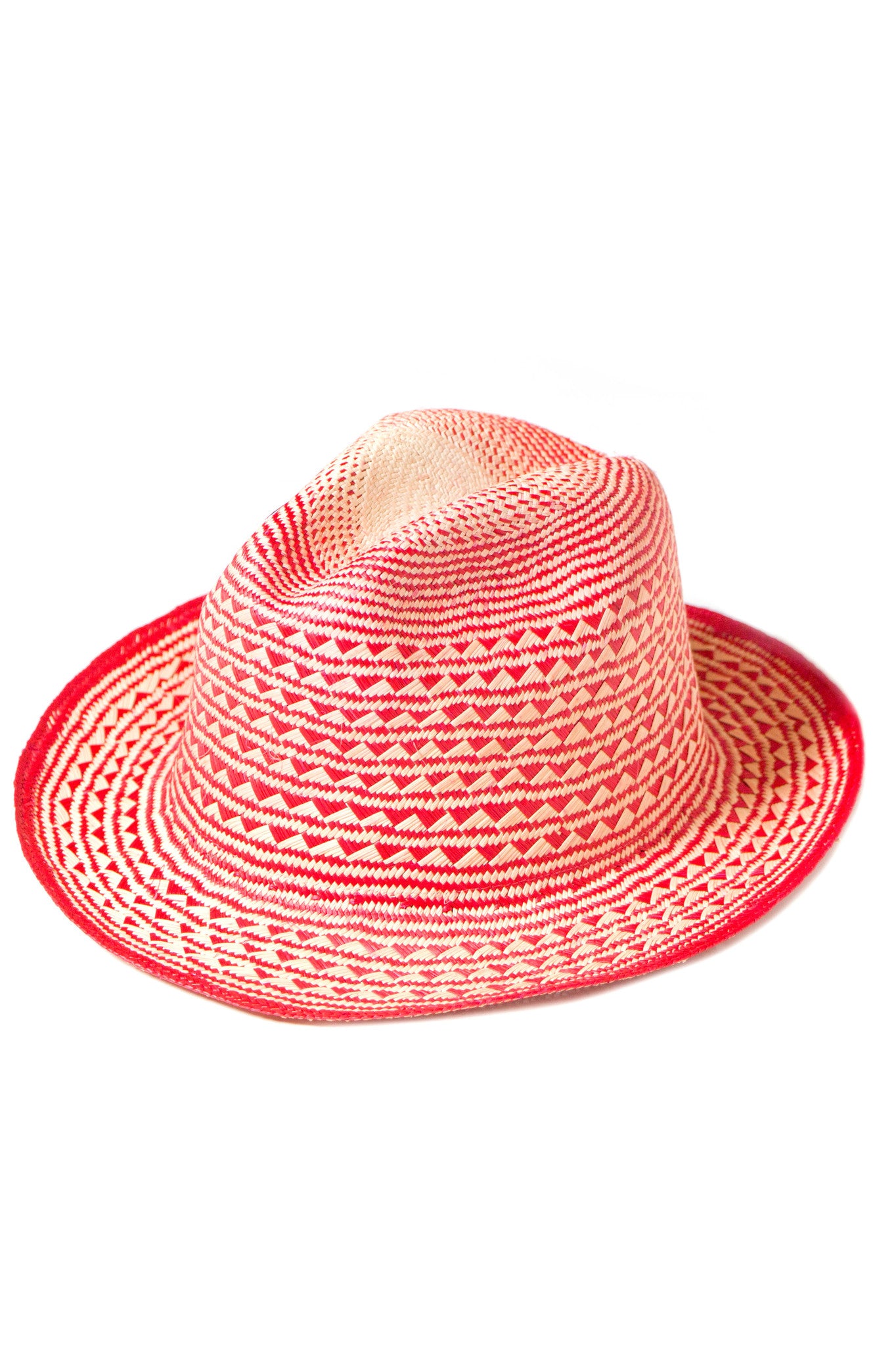 Guanabana Handmade Pyramid Panama Hat. Fedora style hat made from natural straw featuring a red woven pyramid pattern. Interior elastic band around the brim to ensure a snug fit. Handcrafted by artisans in Colombia. 2 inch brim. 5 inch crown. Color red natural. One size fits most.