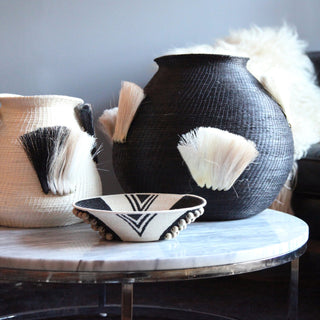 Fanned Out Large Bulbous Vase in Black/White by Charlie Sprout. Handmade in Swaziland, these unique and bold decorative accents support female artisans and are bold additions to any room. Swazi baskets are the most labor intensive of all the African baskets, taking between 30-80 hours to make each piece.