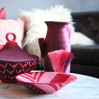 Fanned Out Small Tall Vase by Charlie Sprout. Handmade in Swaziland, these unique and bold decorative accents support female artisans and are bold additions to any room. Swazi baskets are the most labor intensive of all the African baskets, taking between 30-80 hours to make each piece. 