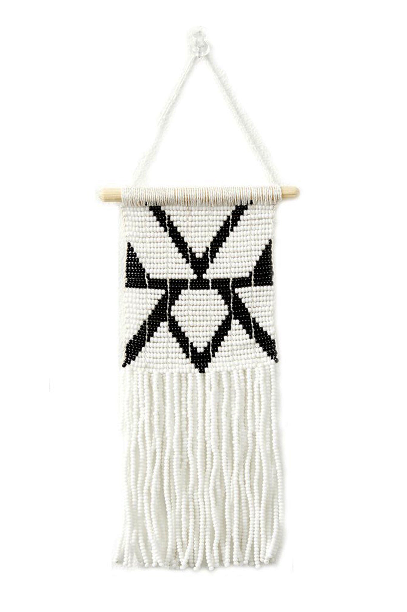 Rhombus Beaded Wall Hanging by Sidai Designs. Handmade in Tanzania. Glass beaded wall hanging with a beaded fringe finish. The beaded panel is handwoven together with recycled grain sacks onto a wooden dowel. Color black and white.