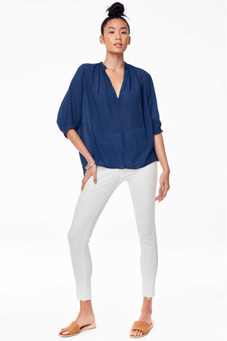 Accompany Exclusive Sitting Pretty Asmara Top in Carbon. Loose oversized blouse with gathered split V-neckline, three quarter sleeve, gathering at back panel, dipped curved back hem. Pull over style. Measures 24 inches from shoulder to hem. Color navy. 100% ghost chiffon. Sizes Small Medium Large.