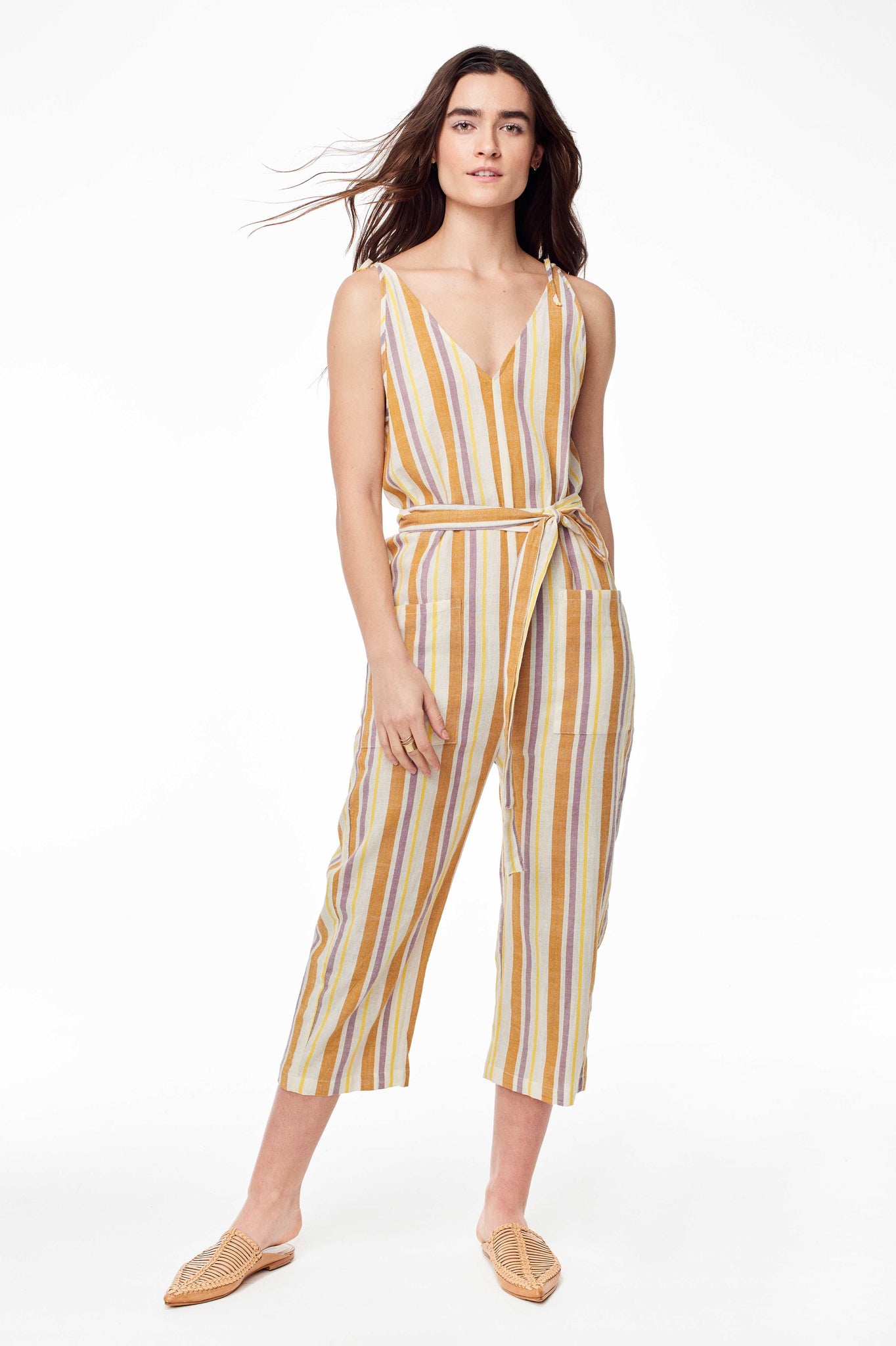 Wax and Cruz Spring 2018 Cabiria Jumpsuit in 70's Stripe. Soft handwoven cotton and sexy shoulder ties. V-neckline with removable matching tie wasit belt. Loose fitting with front patch pockets on trouser. Ankle crop. Unlined. Small/Medium measures 50.5 inches from shoulder to hem. Color yellow stripe. 100% cotton. Sizes Small/Medium Medium/Large.
