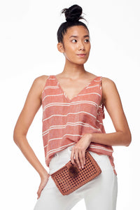 Wax and Cruz Spring 2018 Sol Tank Top in Rust Stripe. Soft handwoven cotton and sexy shoulder ties for adjustable loose fit. V-neckline. Small/Medium measures 24 inches from shoulder to hem. Color red and white stripe. 100% cotton. Sizes Small/Medium Medium/Large.