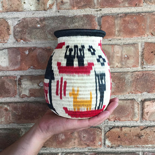 Wounaan Art Vase by Tulia's Artisan Gallery. Handcrafted in Colombia. One of a kind statement home decor vase with an ethnographic design. All handcrafted by award-winning indigenous Wounaan artisans of Colombia. Color multi. 100% palm leaf.