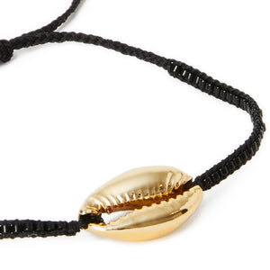 gold-plated cowrie shell on black woven bracelet
