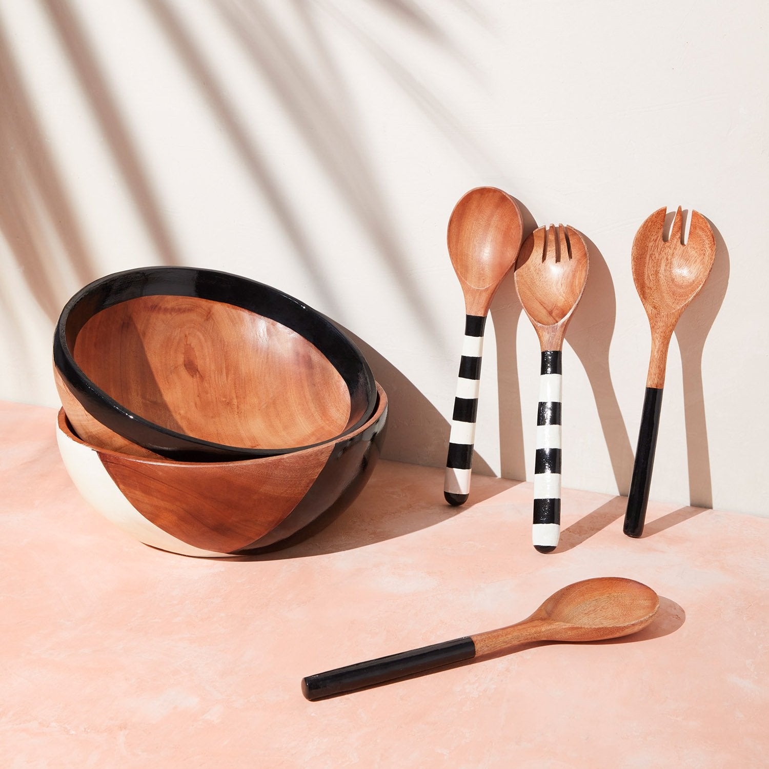 black and white wooden serving utensils and bowls